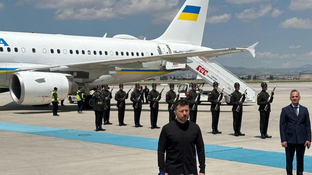 Zelensky speaks to reporters in front of his plane after arriving in Ankara