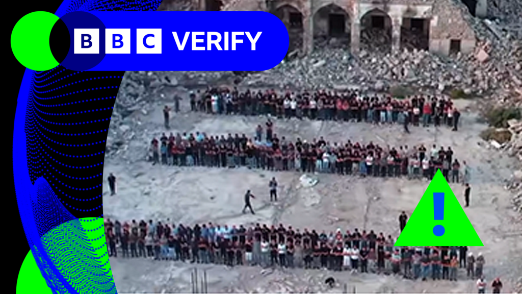 A screengrab from an AI fake video with a green warning triangle