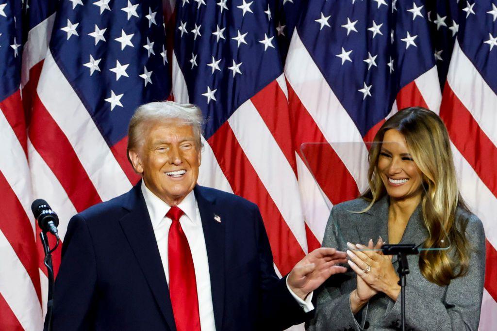 A smiling Donald and Melania Trump during an election night event at the Palm Beach Convention Center in Florida on 6 November 2024