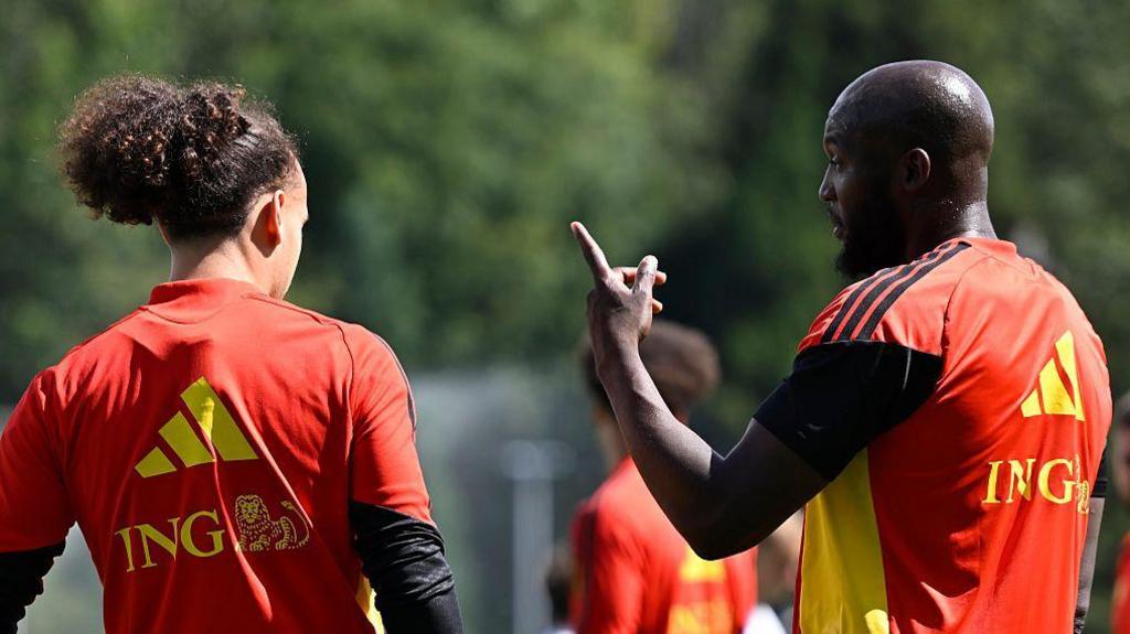 Romelu Lukaku gives instructions to team-mate Arthur Theate during a Belgium training session at the 2026 World Cup
