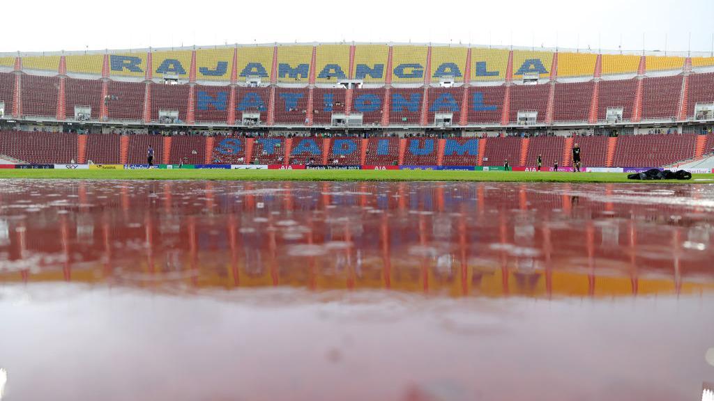 The waterlogged pitch at Rajamangala National Stadium