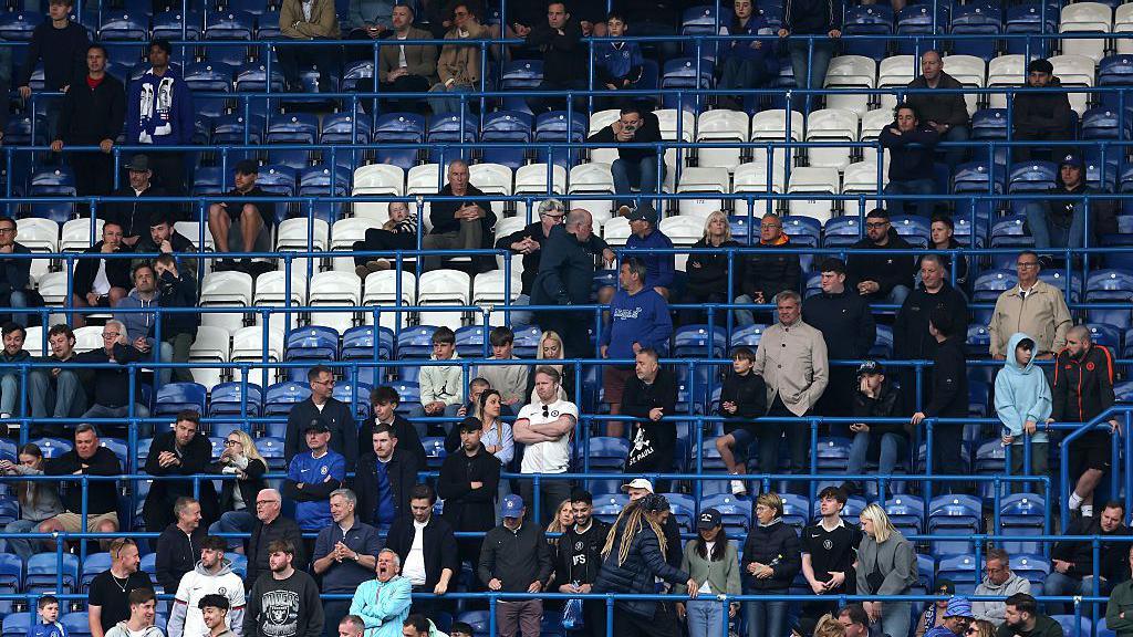 Chelsea supporters watching team against Nottingham Forest with gaps and seats free during the latter minutes of a match they lost