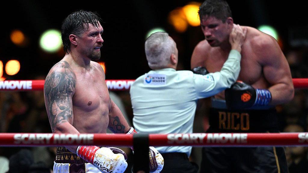 Referee Mark Lyson stops the fight as Oleksandr Usyk walks away