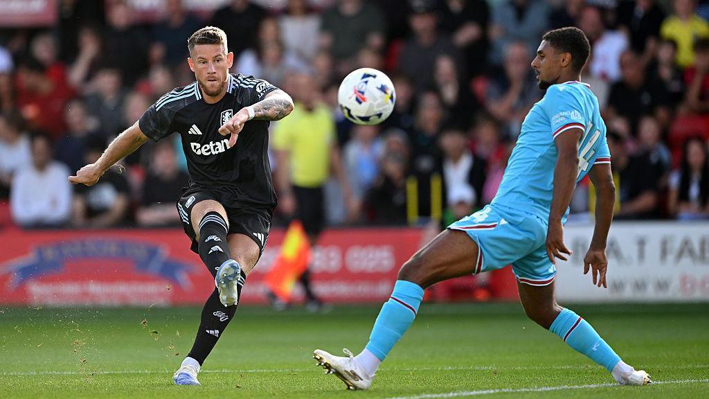 Ross Barkley of Aston Villa shoots past Brandon Comley of Walsall in a pre-season friendly