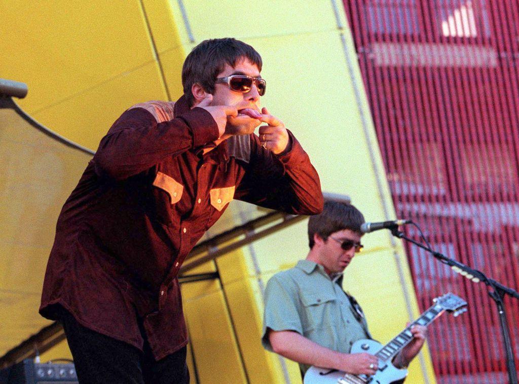 Liam Gallagher sticks his tongue out during an Oasis show in San Francisco, 1997
