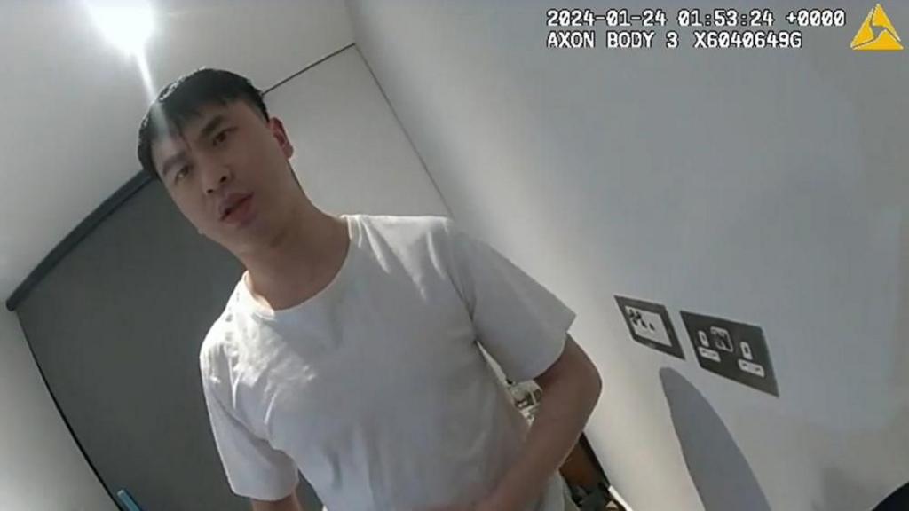 Undated handout screengrab from body worn camera of the arrest of Zhenhao Zou
