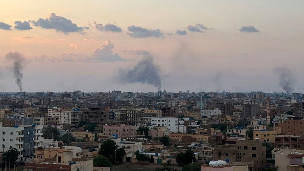 smoke rises after air strikes on central Khartoum on 12 october