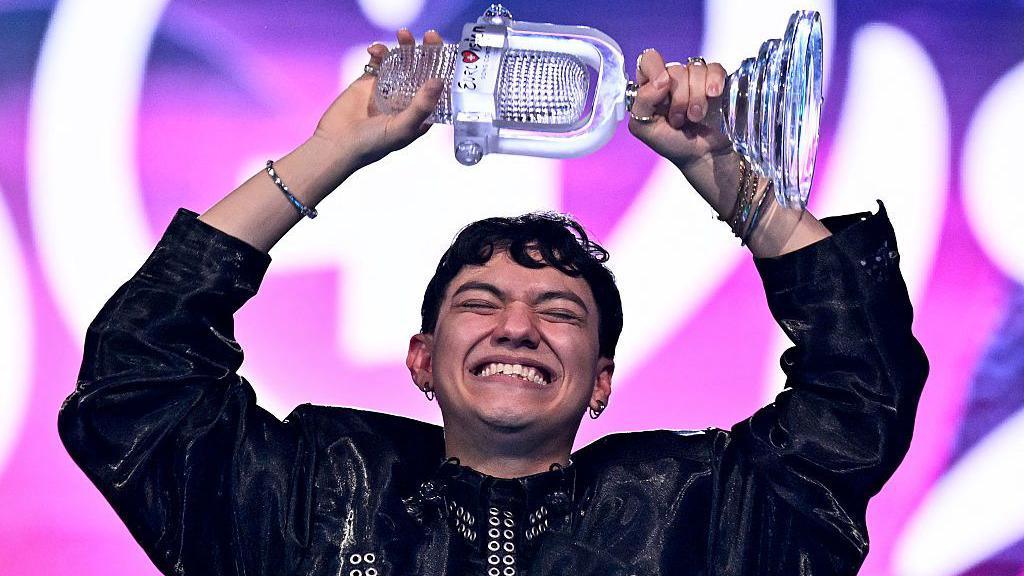 Austrian singer Johannes Pietsch, known as JJ representing Austria with the song "Wasted Love" celebrates with the 2025 Eurovision Song Contest trophy