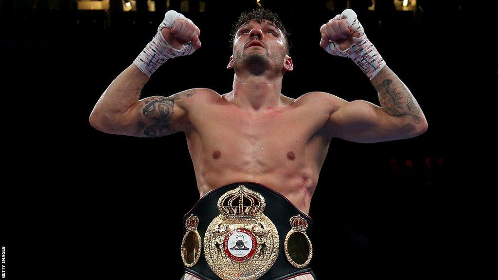 Leigh Wood celebrates with the WBA featherweight belt