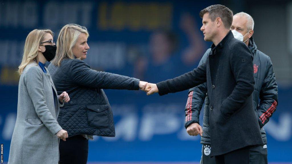 Jens Scheuer shaking hands with Emma Hayes