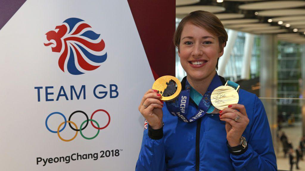 Two-time Olympic gold medallist Lizzie Yarnold celebrates with her medals at the 2018 Winter Olympic Games in Pyeongchang, South Korea