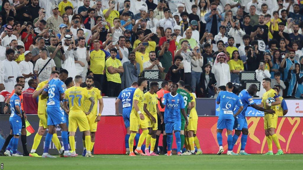 Al-Nassr and Al-Hilal players in a melee following Cristiano Ronaldo's clash with Ali Al Bulayhi