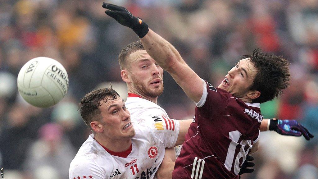 Galway's Cathal Sweeney battles with Tyrone's Conn Kilpatrick and Brian Kennedy