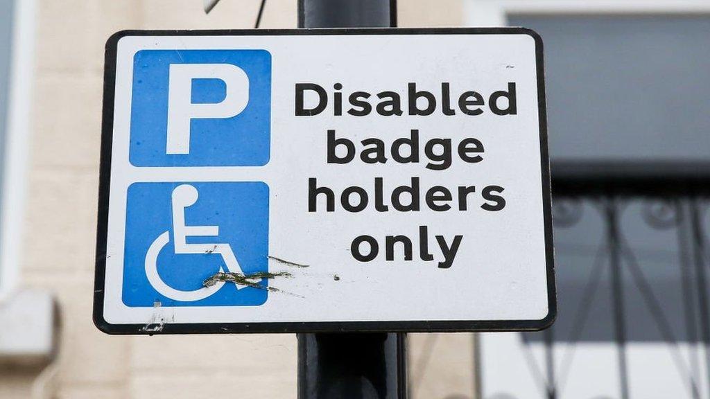 A disabled parking sign