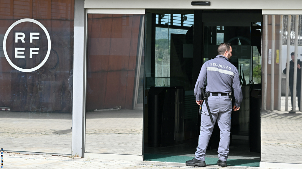 A security guard stands outside the headquarters of the Spanish Football Federation in Madrid on Wednesday