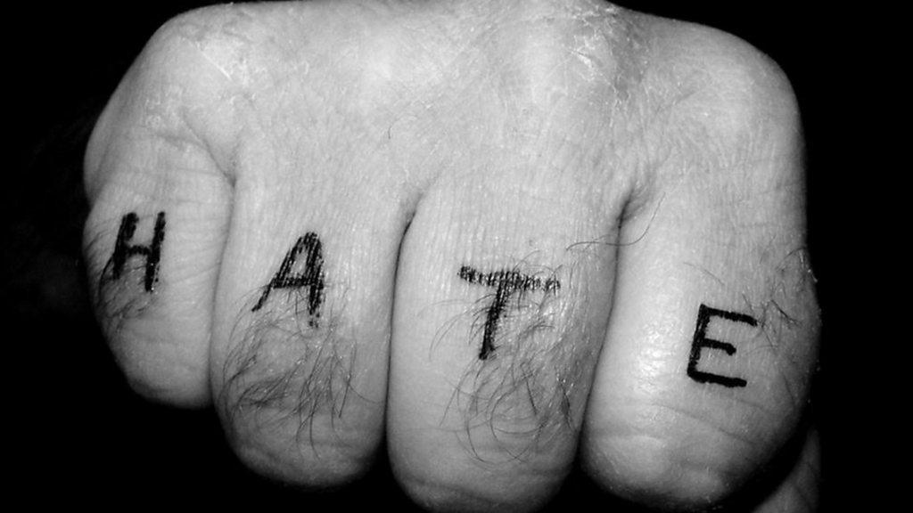 Knuckle tattoo reading 'Hate'