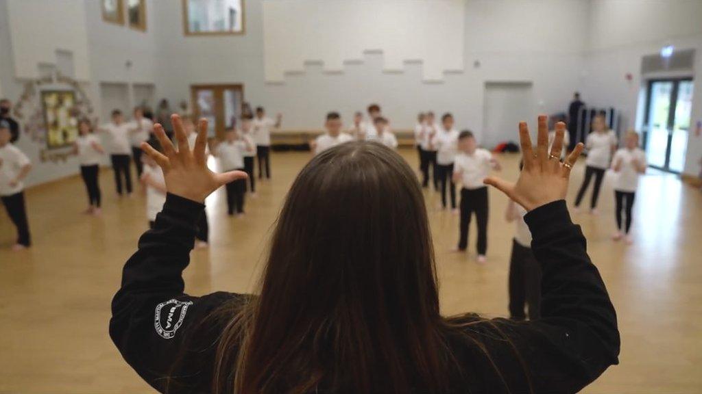 School children in a gym class