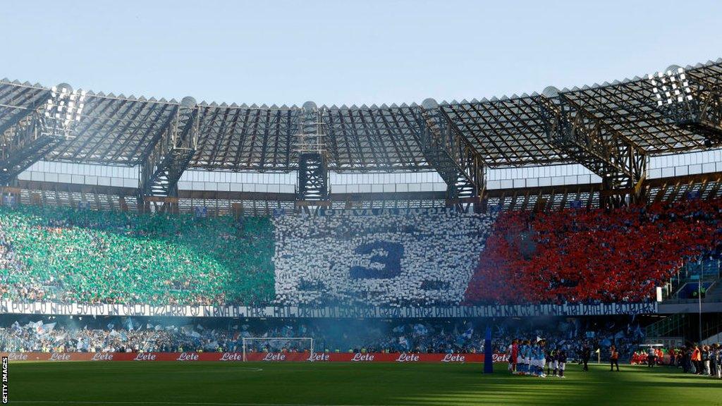 Napoli fans display the number three in the stands