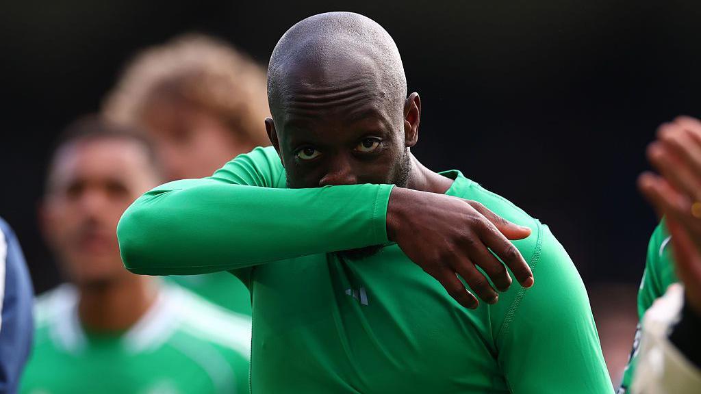 Yoane Wissa wipes his nose on his arm