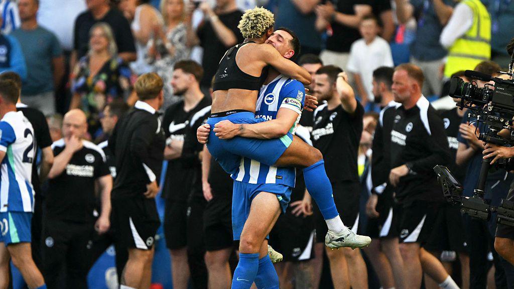 Brighton players Georginio Rutter and Lewis Dunk celebrate after securing European football