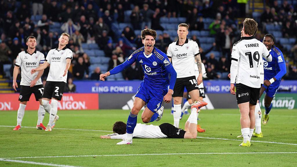 Ben Nelson of Leicester City in an all-blue kit celebrates scoring the opening goal for Leicester City against Bristol City