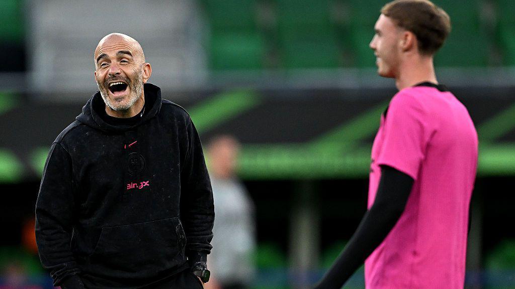 Enzo Maresca shares a joke with Cole Palmer during Tuesday's open training session at Wroclaw Stadium
