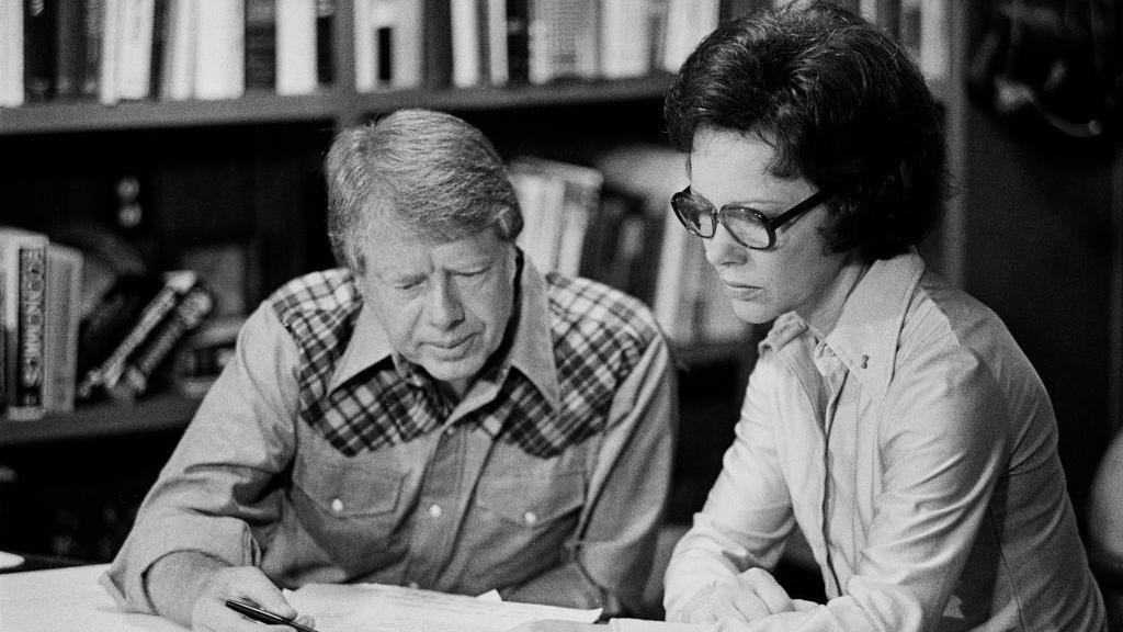 The Carters sit at a table working during Jimmy Carter's presidential campaign.