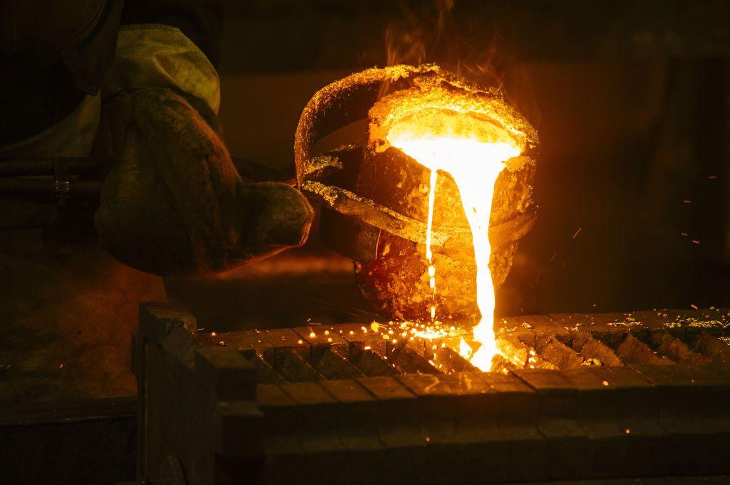 A worker pours molten gold into a mould during the refining of bullion at a plant in South Africa, on 16  August 2017