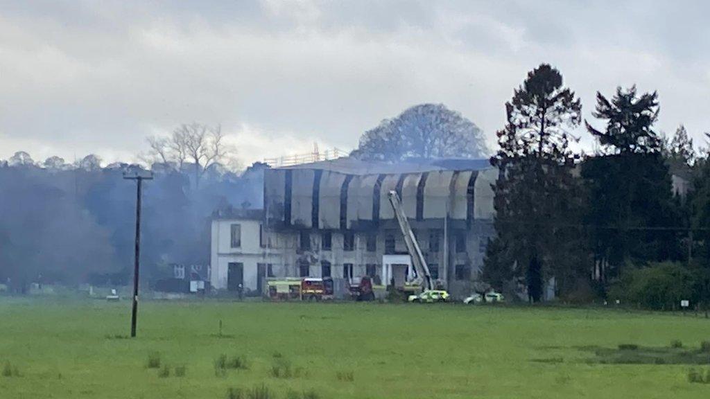 Photograph shows emergency services at the scene