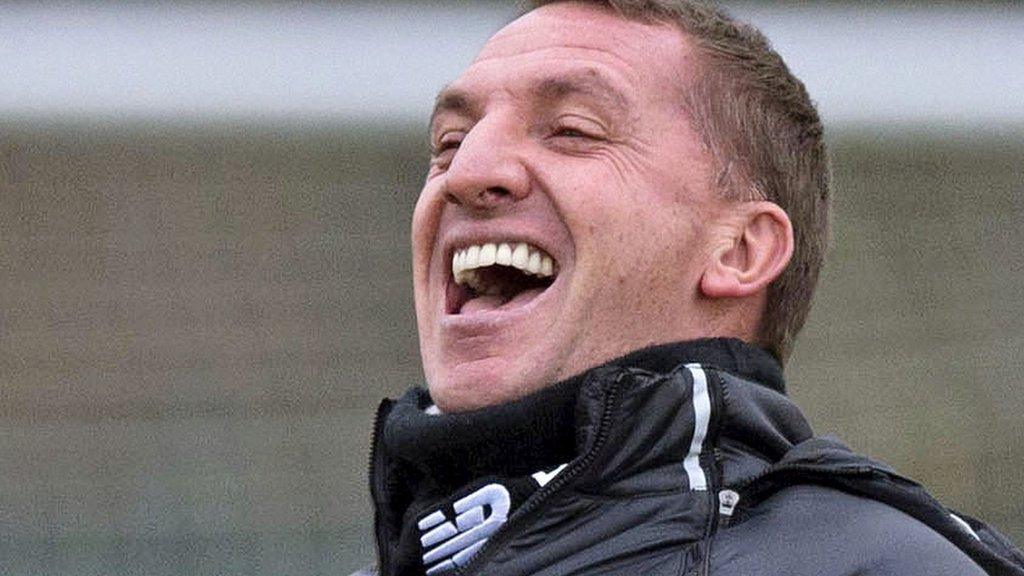 Brendan Rodgers shares a joke at Celtic training on Thursday