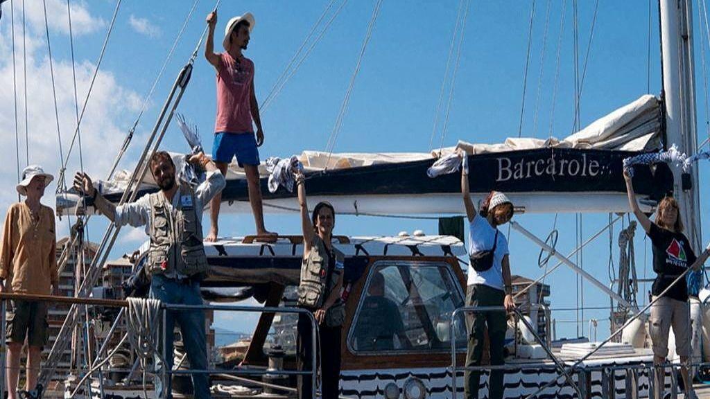 Activist Greta Thunberg and crew stand aboard the aid ship Madleen