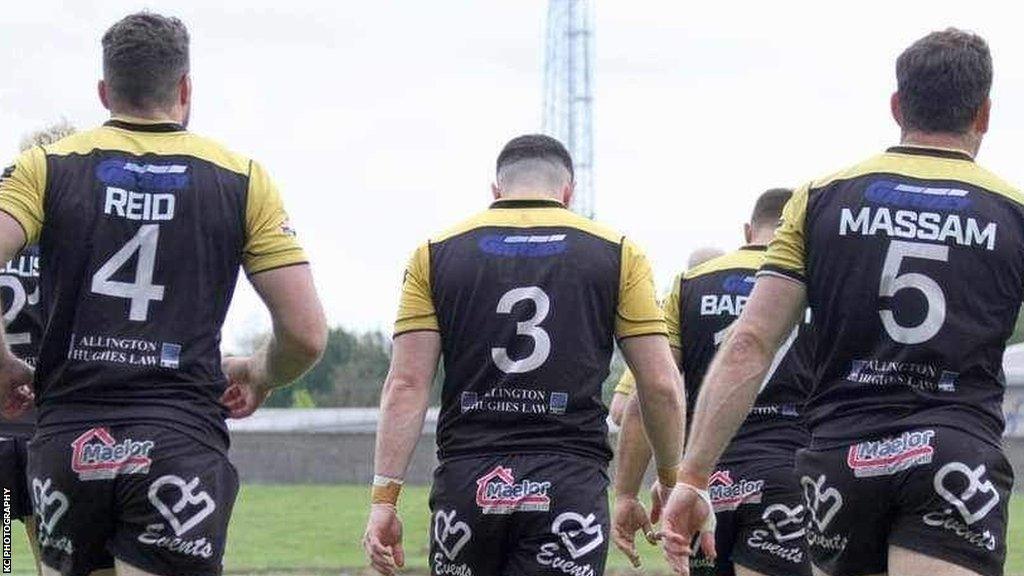 Crusaders players walk out onto the pitch