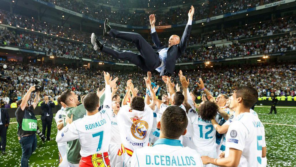 Real Madrid players throw Zinedine Zidane in the air