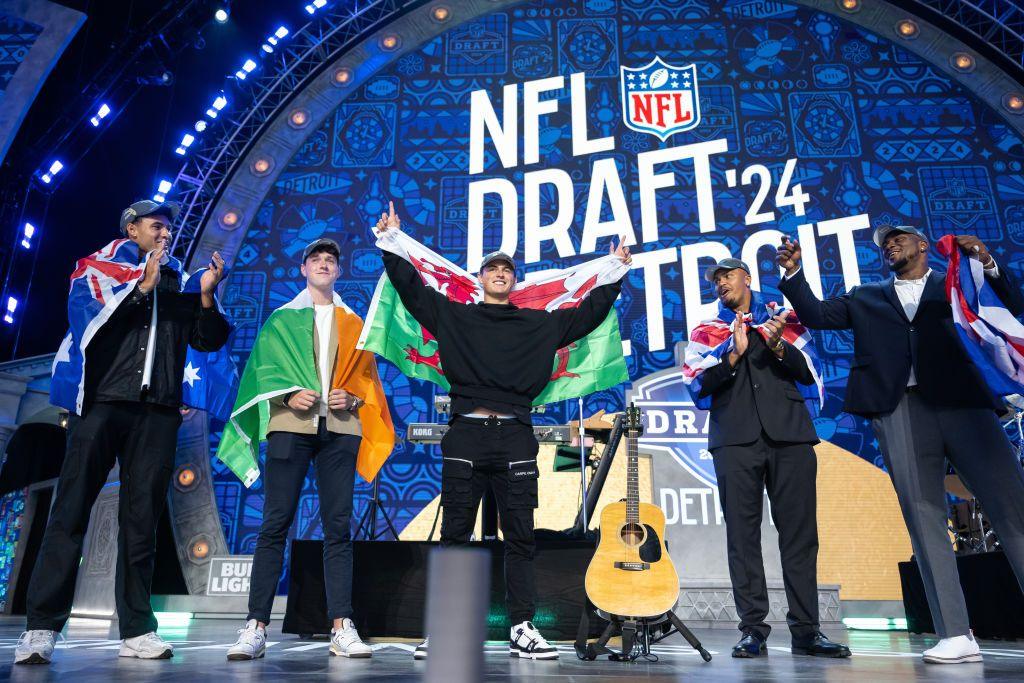 (L-R) Patrick Murtagh, Charlie Smyth, Louis Rees-Zammit, Travis Clayton, and Bayron Matos are recognized on stage after day 3 of the NFL Draft at Campus Martius Park and Hart Plaza on April 27, 2024 in Detroit.