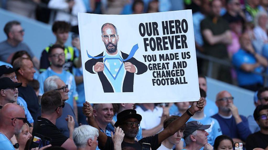 A sign is seen dedicated to Pep Guardiola during the Premier League match between Manchester City and Aston Villa