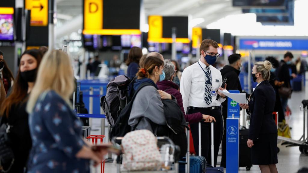 Airline staff and passengers at Heathrow Airport