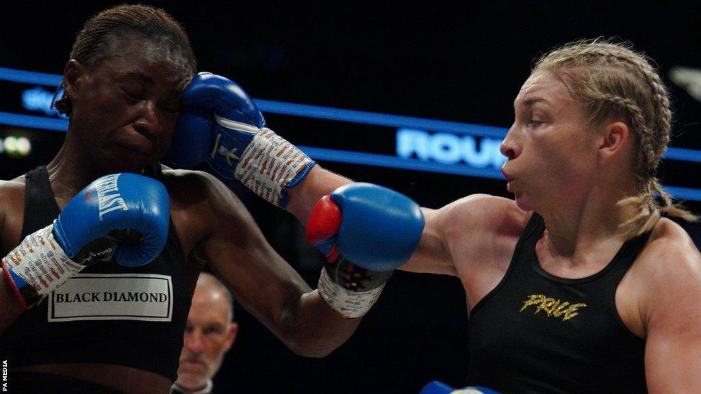 Lauren Price (R) lands a blow on Lolita Muzeya