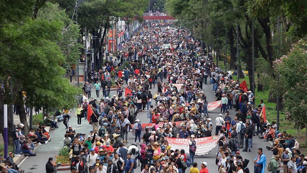 Teachers march along Calzada de Tlalpan in Mexico City, heading towards the Azteca stadium