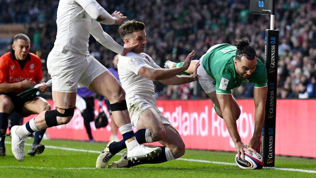 Ireland's James Lowe dives in to score a try against England at Twickenham