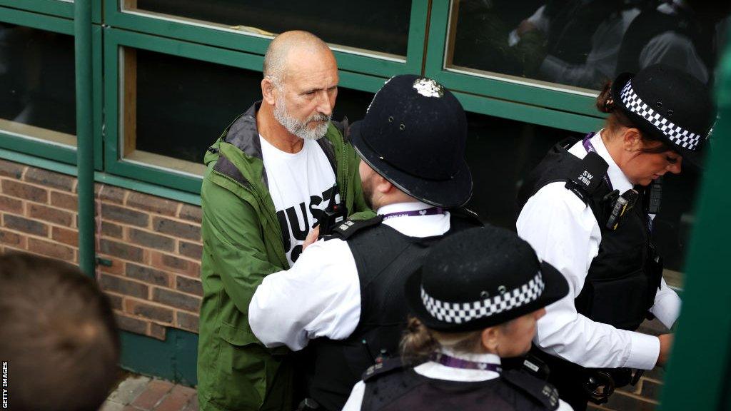 A Just Stop Oil protester was taken off court 18 by police officers