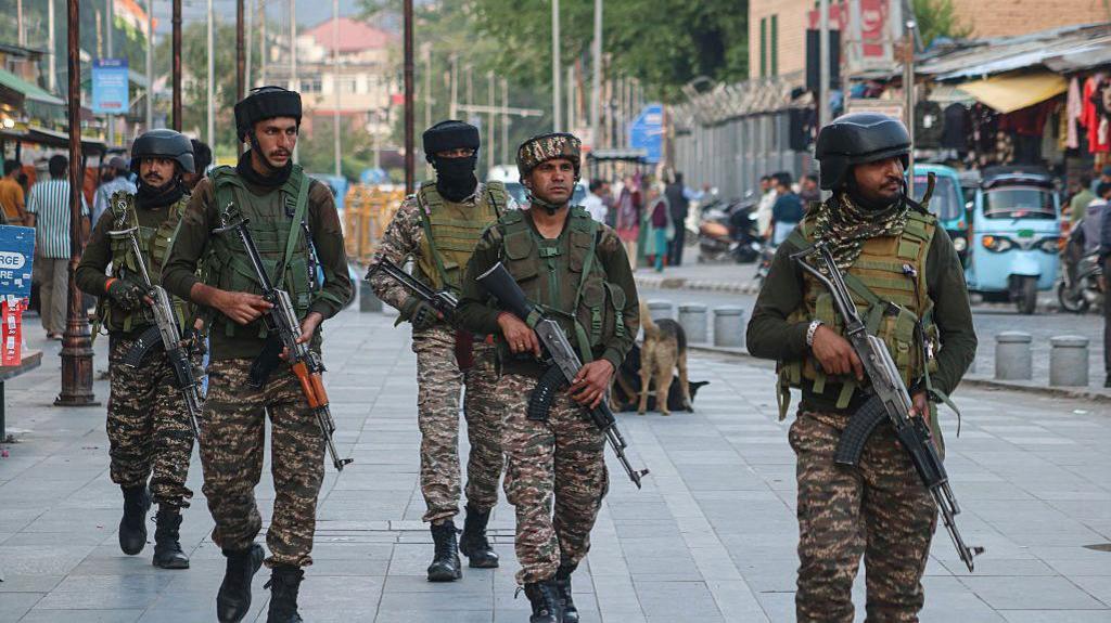 A group of Indian paramilitary soldiers patrol near the Clock Tower (Ghanta Ghar) in Srinagar, Jammu and Kashmir, on May 7, 2025.