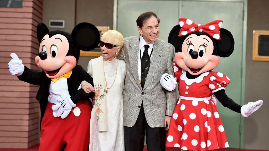 (L-R) Mickey Mouse, Elizabeth Sherman, Songwriter Richard M. Sherman and Minnie Mouse attend the dedication and re-naming of the historic Orchestra Stage, now the Sherman Brothers Stage A, on the Disney Burbank lot prior to the world premiere of Disney's 'Christopher Robin' at the studio's Main Theater, on July 30, 2018. 