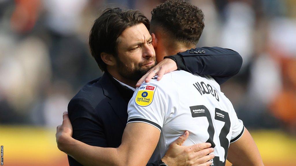 Russell Martin embraces Nathan Wood, one of the youngsters who has impressed at Swansea this season, after their draw at Hull