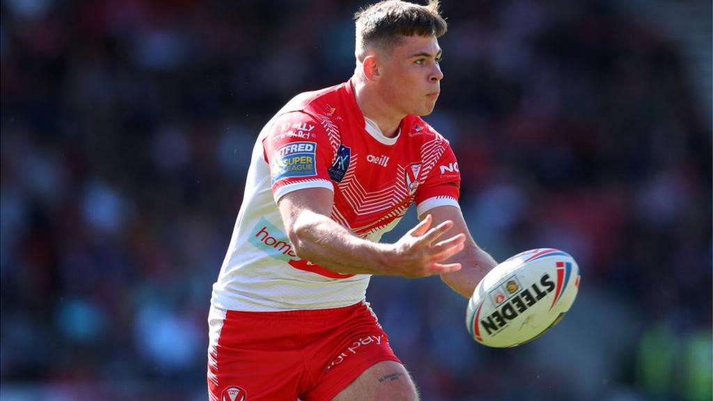 Jack Welsby holding Rugby ball for St Helens