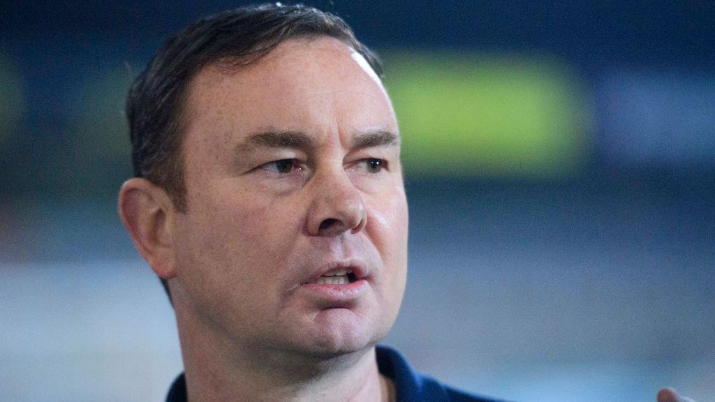 Derek Adams speaks during a news conference as Morecambe manager