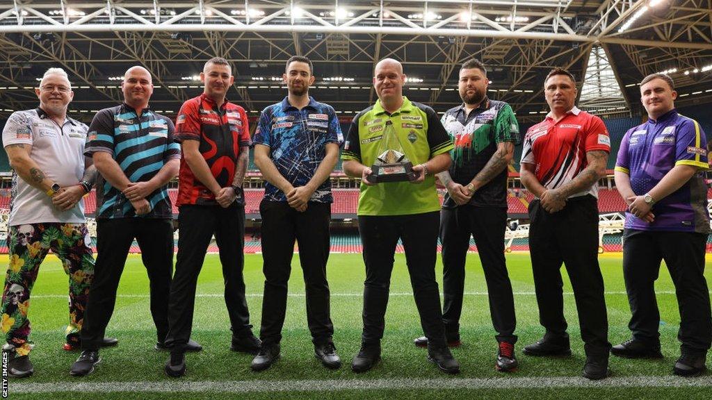 2024 Premier League Darts players. From left to right, Peter Wright, Rob Cross, Nathan Aspinall, Luke Humphries, Michael van Gerwen, Michael Smith, Gerwyn Price and Luke Littler