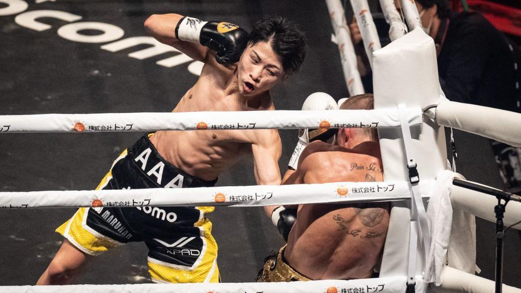 Naoya Inoue punches Paul Butler in the corner of the ring