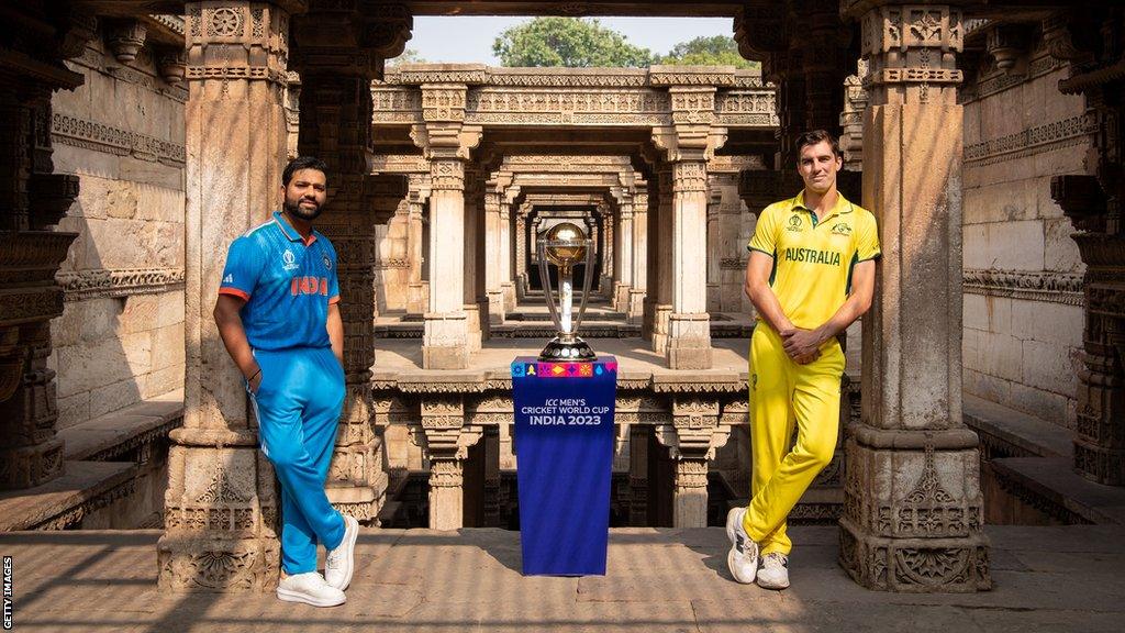 Rohit Sharma and Pat Cummins with World Cup trophy