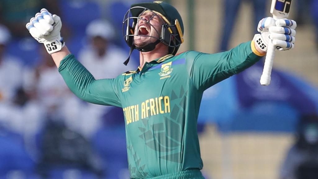 South Africa batter Quinton de Kock roars in celebration after hitting a century