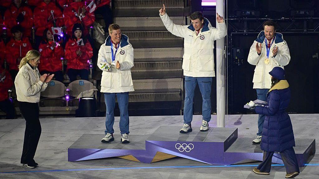 Athletes on the podium receiving their medals.